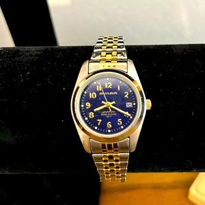 Vintage Milano womens gold and silver tone watch blue face